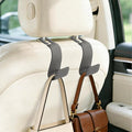 2-Pack Car Headrest Hooks, 1.1-Inch Wide Purse Hangers, Grey | Microfiber leather hooks with built-in metal cores keep purses, groceries and backpacks organized and within reach by Unknown